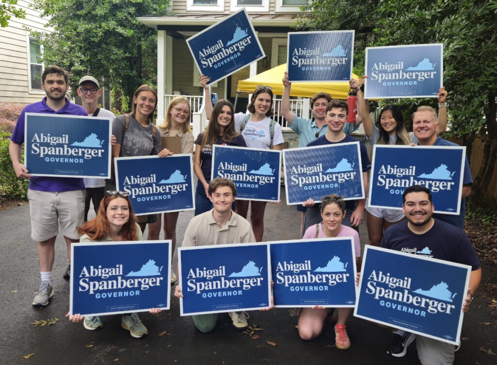 Abigail Spanberger supporter holding signs.
